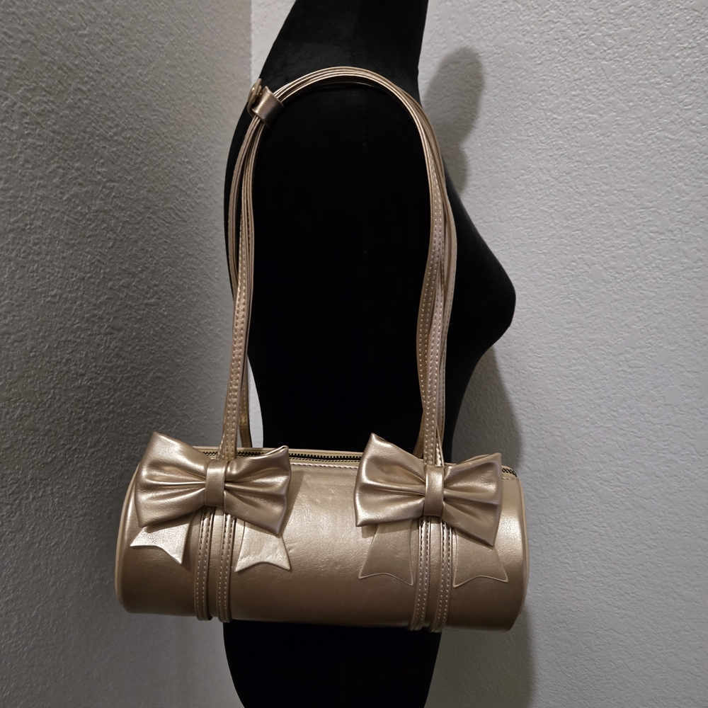Elegant Gold Shoulder Bag with Bow Accents